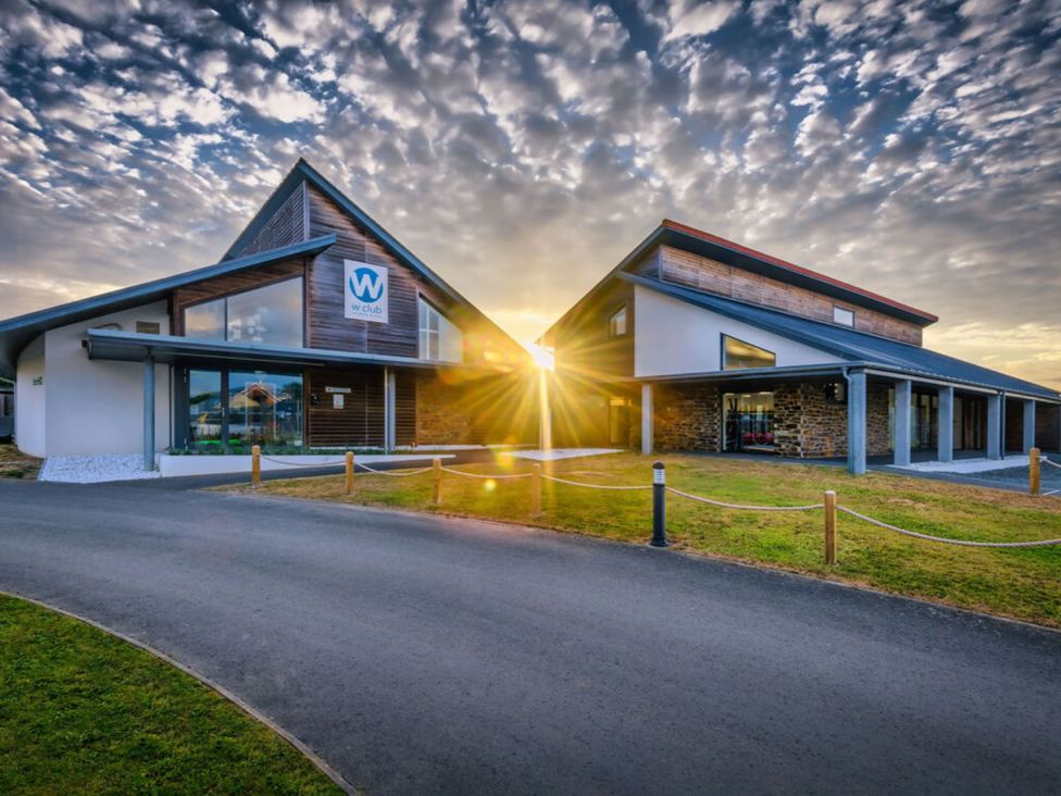 A building with large windows and a sign at Nettlecoombe Spa in Marhamchurch