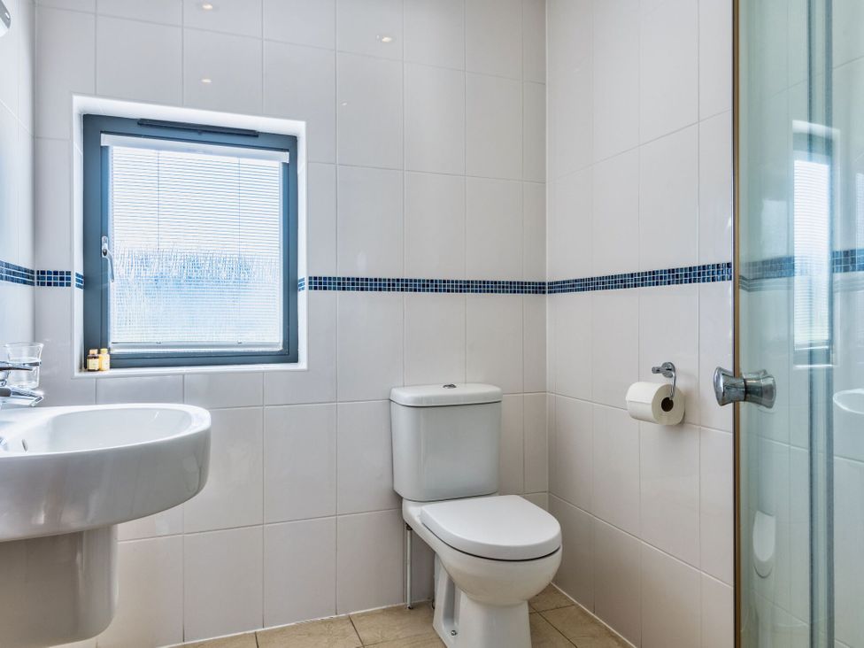 A bathroom with a sink and toilet at Arundell in Marhamchurch