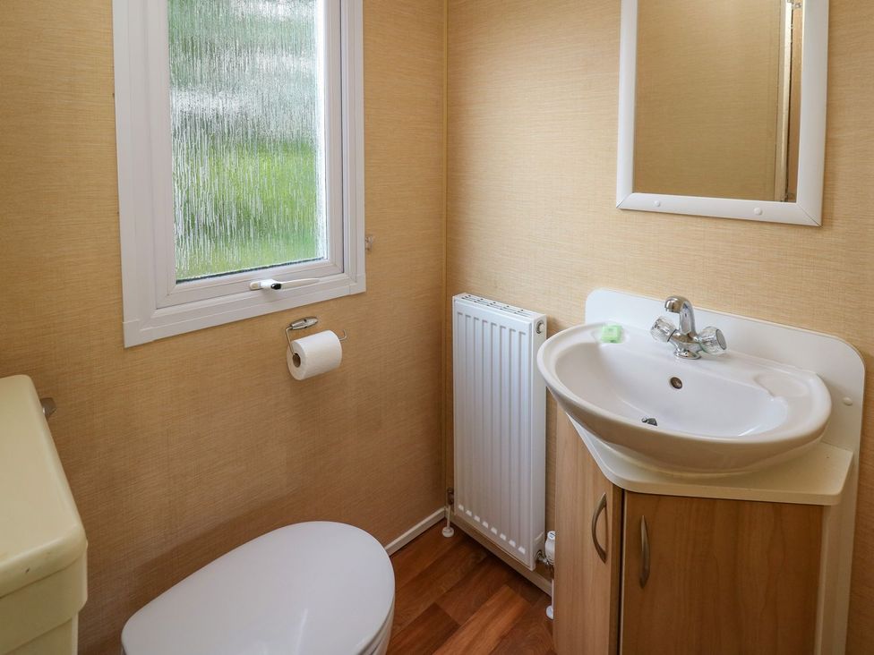 A bathroom with a sink and toilet at Caravan 2 at Blackmoor Farm near tenby