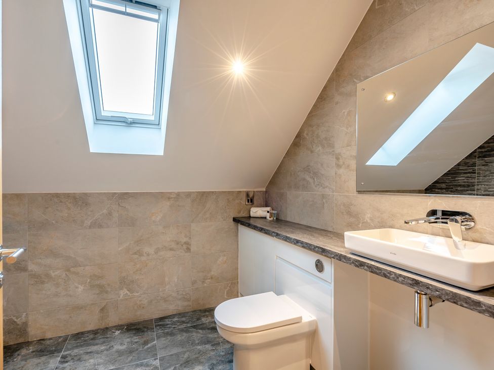A bathroom with a sink and toilet at Tranquillity 4 in Carnforth
