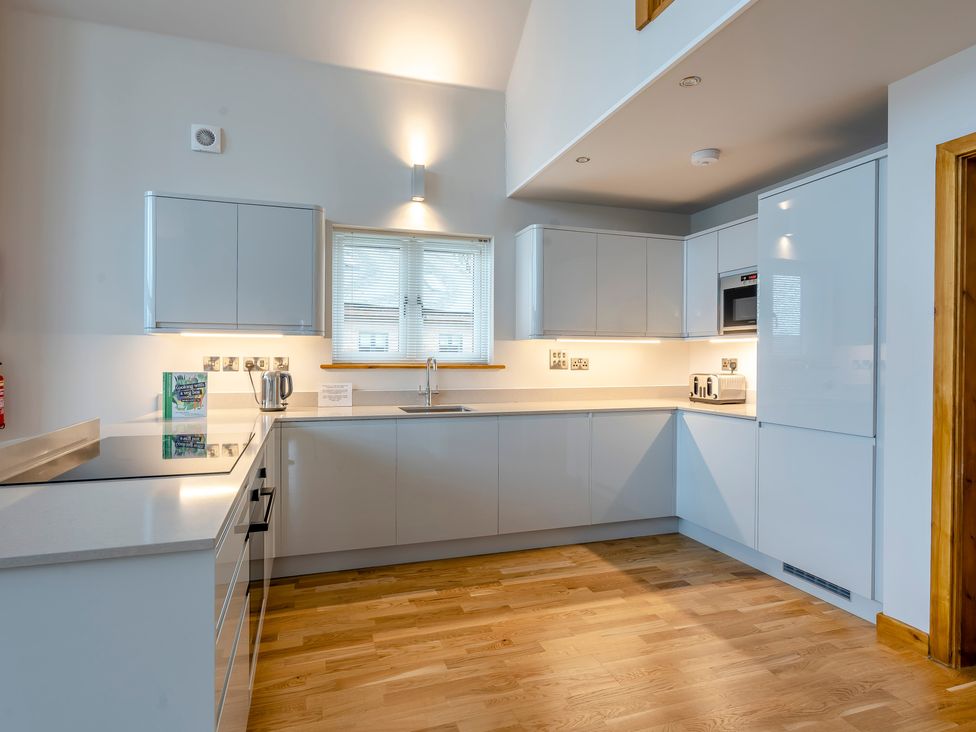 A kitchen with cabinets and sink at Tranquillity 4 (Pet) Carnforth