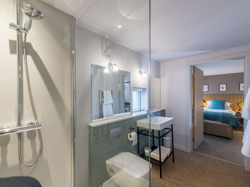 A bathroom with a shower, sink, and toilet at The Telfer North Berwick