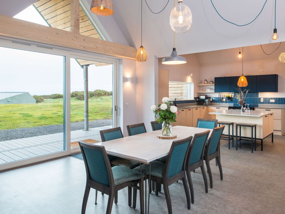 A kitchen with a dining table and chairs at The Irvine in North Berwick