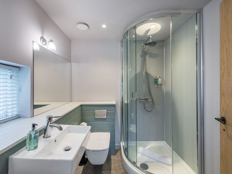 A bathroom with a shower, sink, and toilet at The Irvine in North Berwick