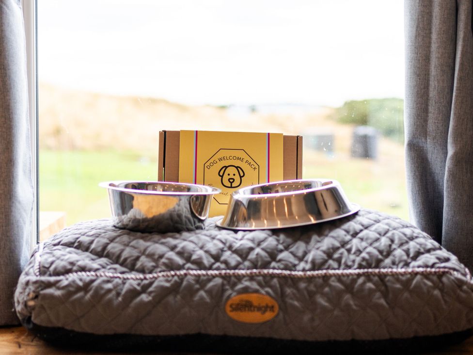A dog bed with bowls and a welcome pack at The Townsend in North Berwick