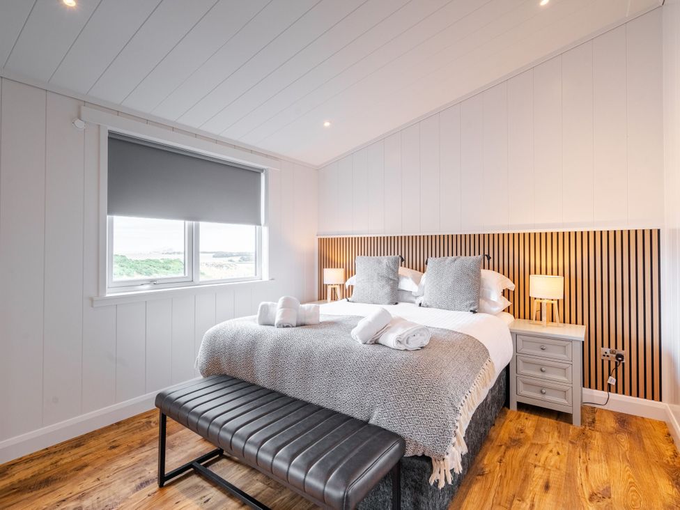 A bedroom with a bed and window at The Townsend in North Berwick