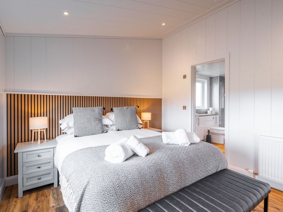 A bedroom with a bed and bedside table at The Townsend in North Berwick