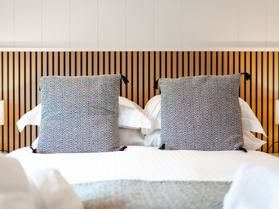 A bedroom with pillows and a headboard at The Townsend in North Berwick