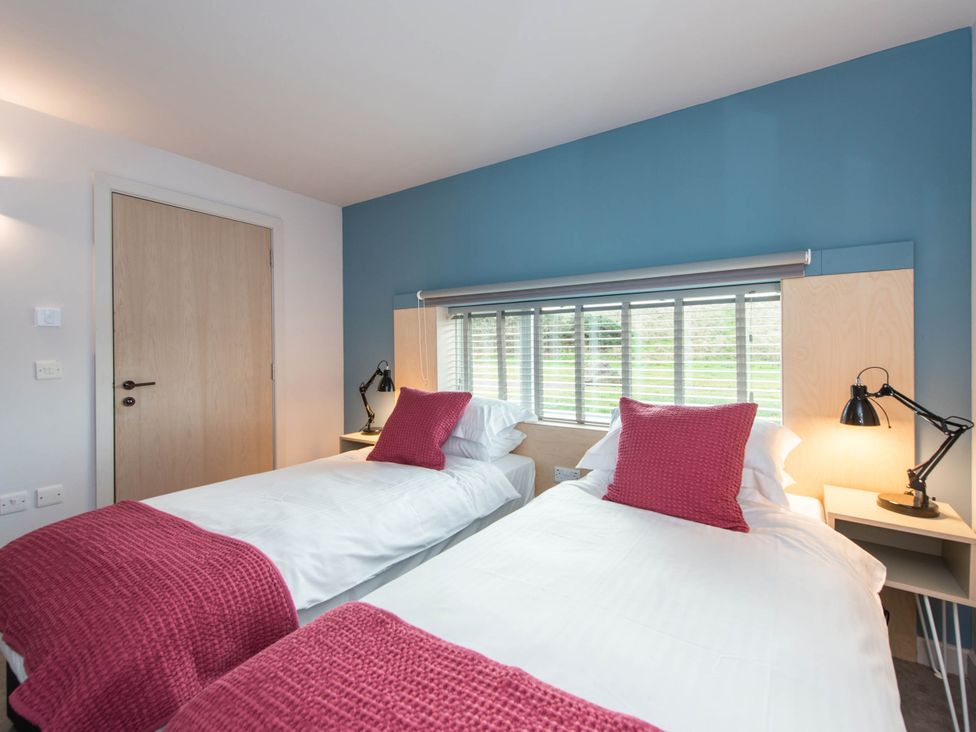 A bedroom with two beds and a window at The Laidlaw Spa in North Berwick