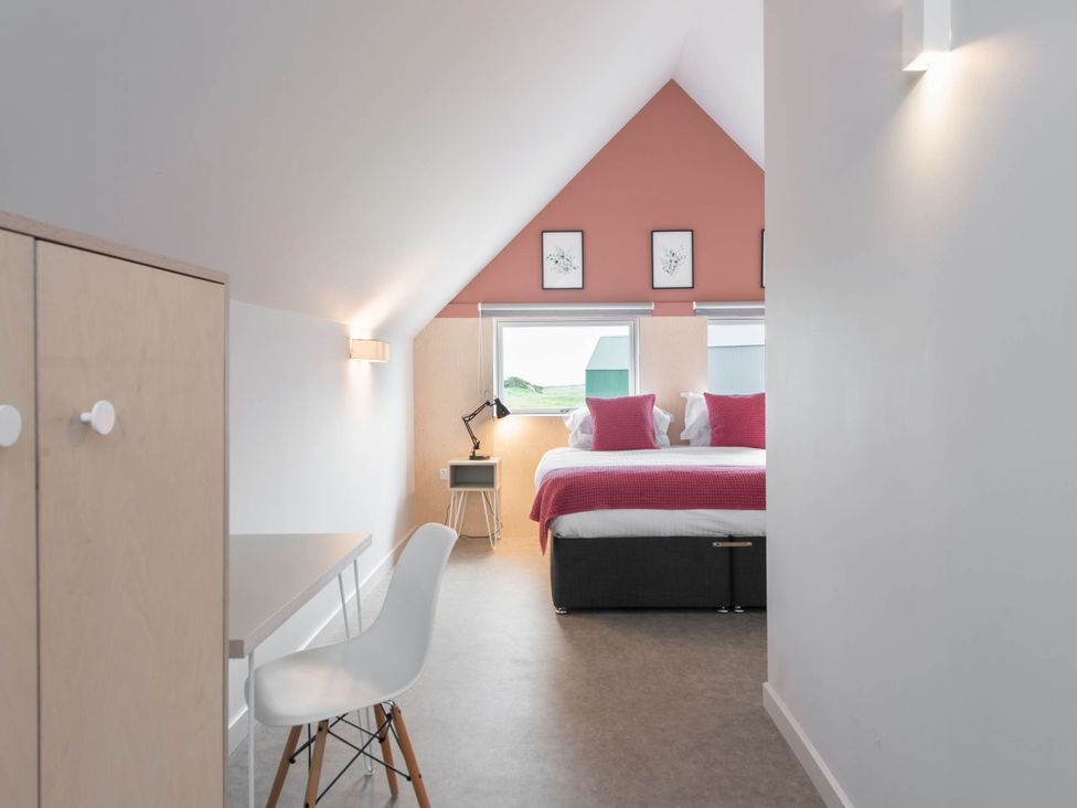 A bedroom with a bed and desk at The Laidlaw Spa in North Berwick