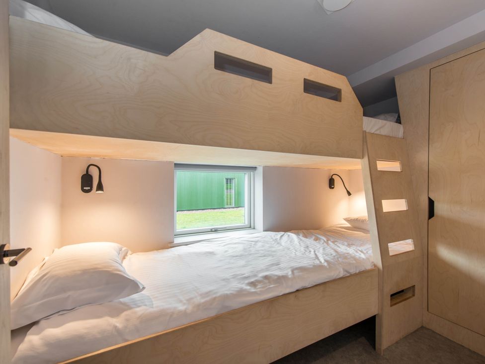 A bedroom with a bunk bed and a window at The Laidlaw Spa in North Berwick
