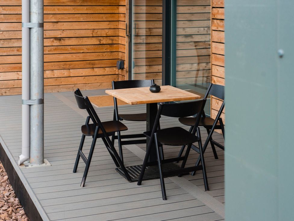 A patio with a table and chairs at The Laidlaw Spa in North Berwick