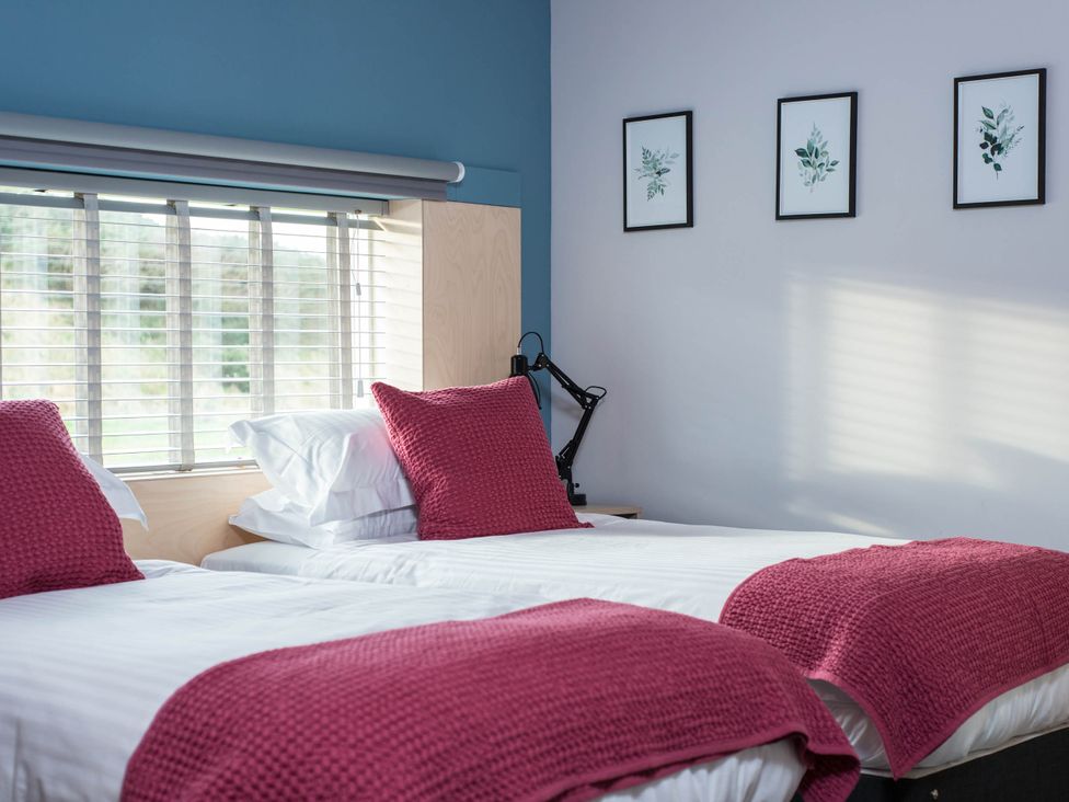 A bedroom with two beds and wall art at The Laidlaw in North Berwick