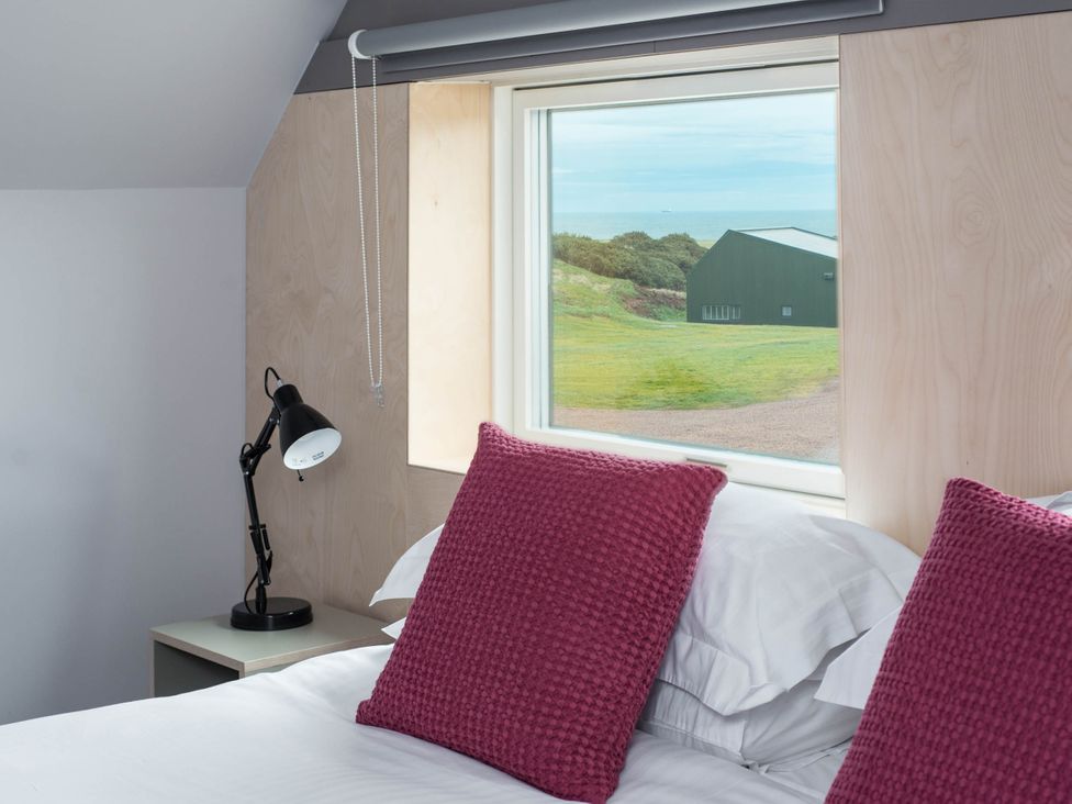 A bedroom with a window and bed at The Laidlaw in North Berwick