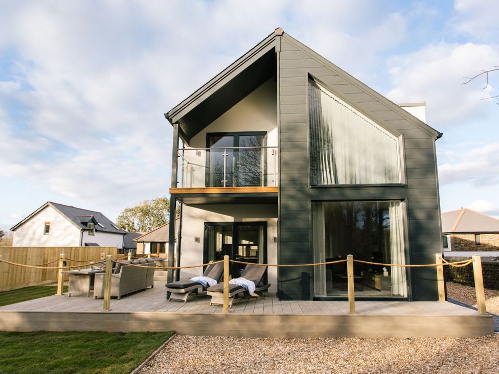 A house with a balcony and decking at The Glasshouse in Bude