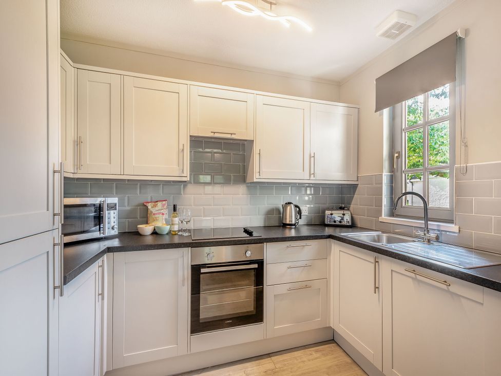 A kitchen with cabinets and appliances at Brunston in Dailly