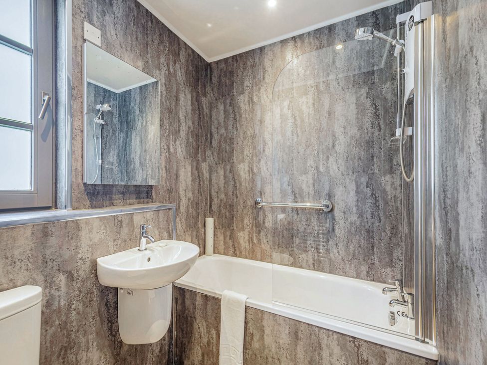 A bathroom with shower and basin at Brunston in Dailly