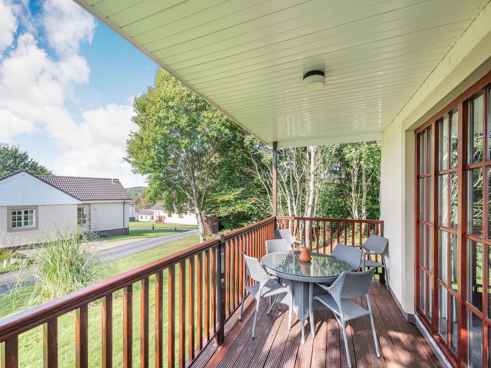 A balcony with a table and chairs at Brunston in Dailly