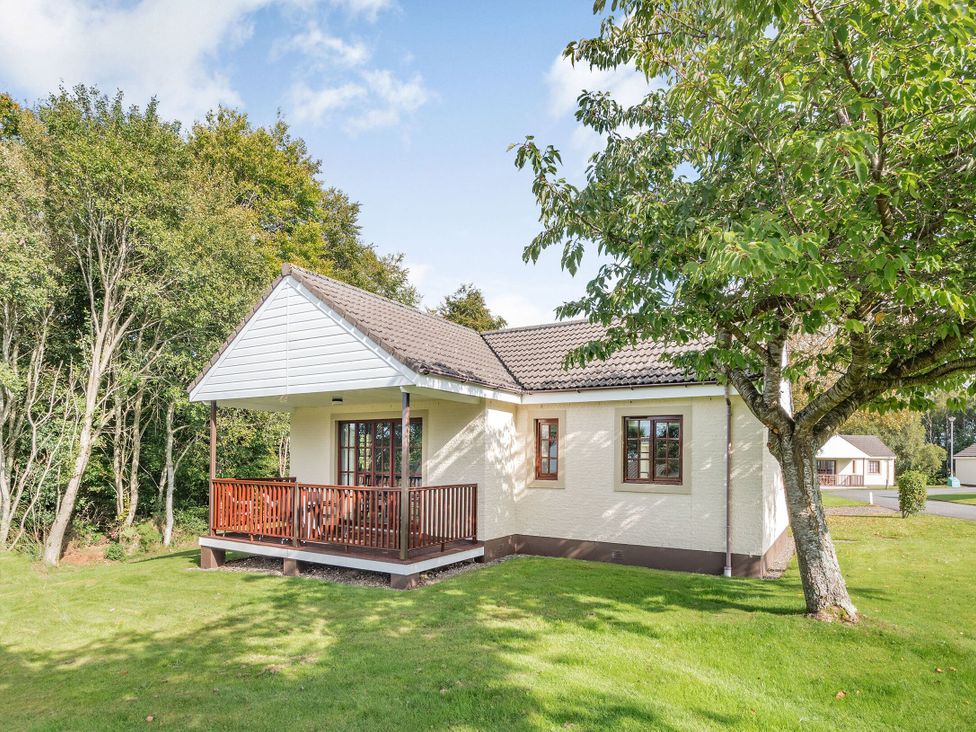 A house with a porch and trees in the garden at Brunston in Dailly