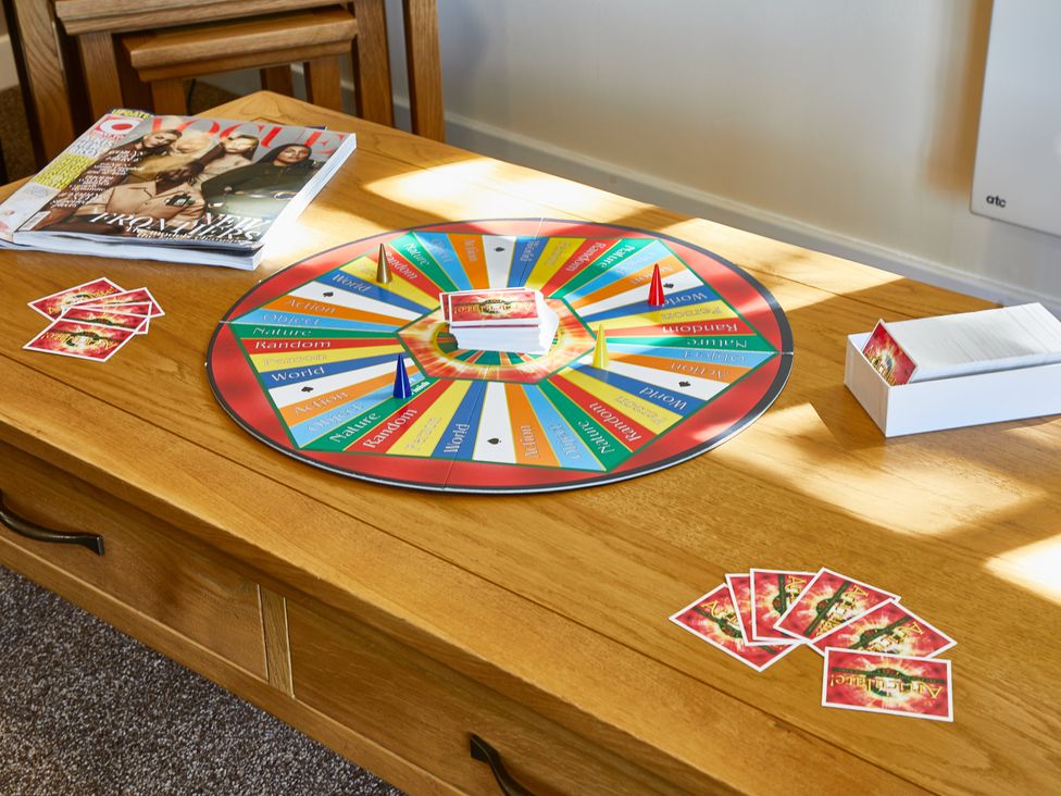 A game board and cards on a table at Brunston (Pet) in Dailly