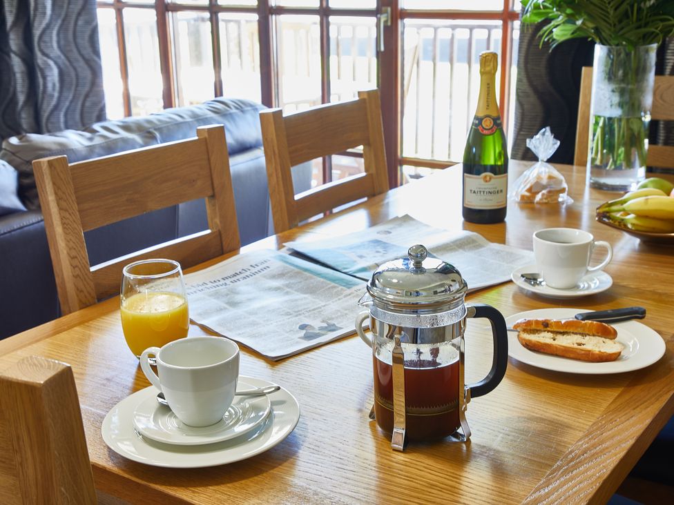 A dining room with a table set for breakfast at Brunston (Pet) in Dailly
