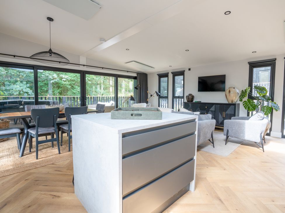 A living room with a sofa and television at Cabin 2.0 Luxe (Pet) Dumfries