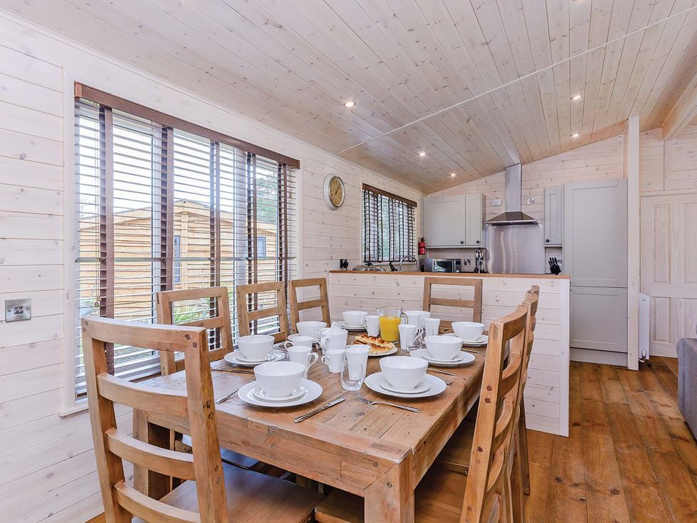 A dining area with a table set for breakfast at Lancaster Lodge in Fair Oak