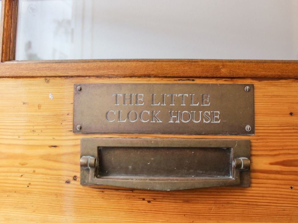 A door with a nameplate and mail slot at The Little Clock House Dartmouth