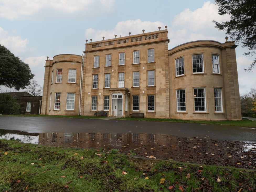 A building with large windows and a front door at Frenchay Park House in Bristol