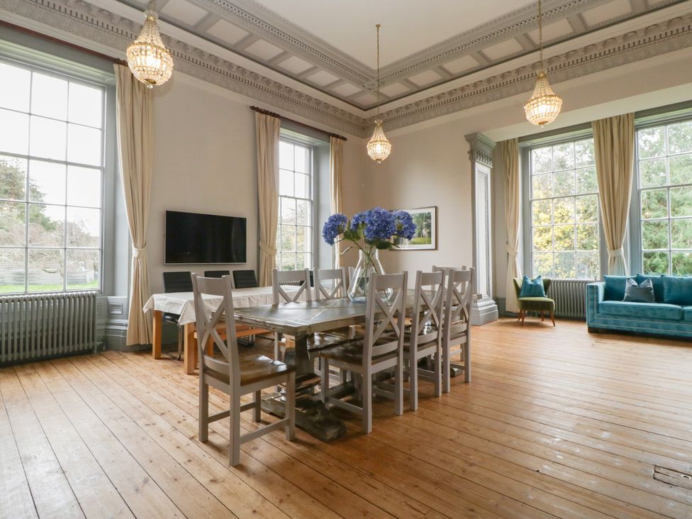 A dining room with a table and chairs at Frenchay Park House in Bristol