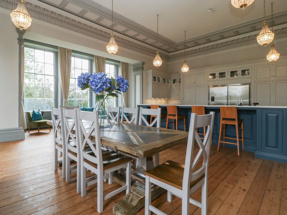 A dining area with a table and chairs at Frenchay Park House in Bristol