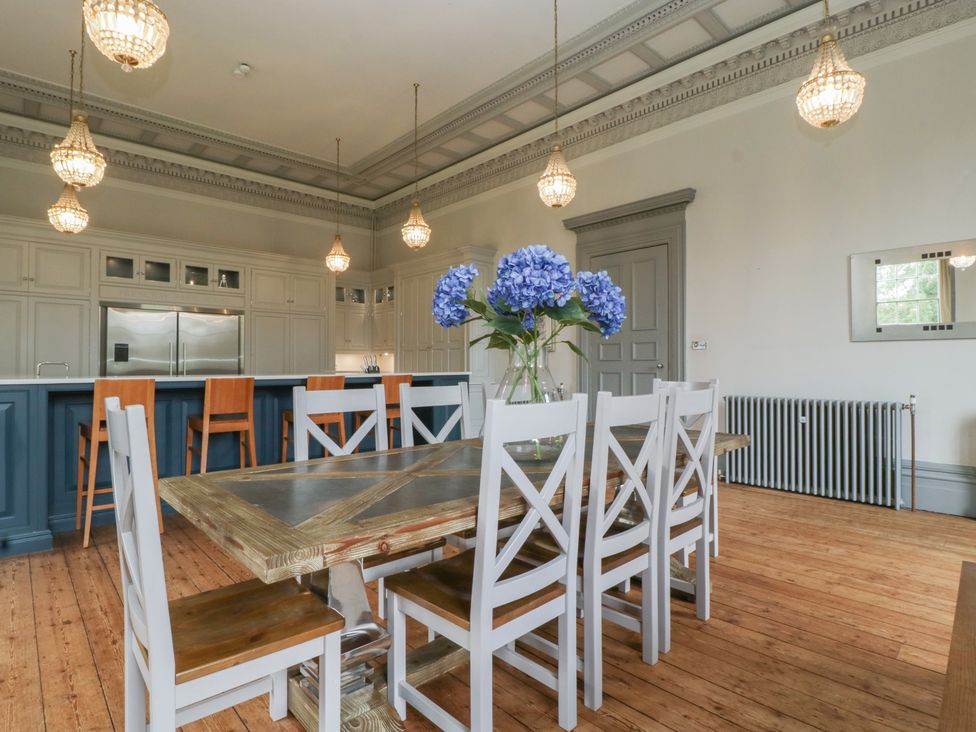 A dining room with a table and chairs at Frenchay Park House in Bristol
