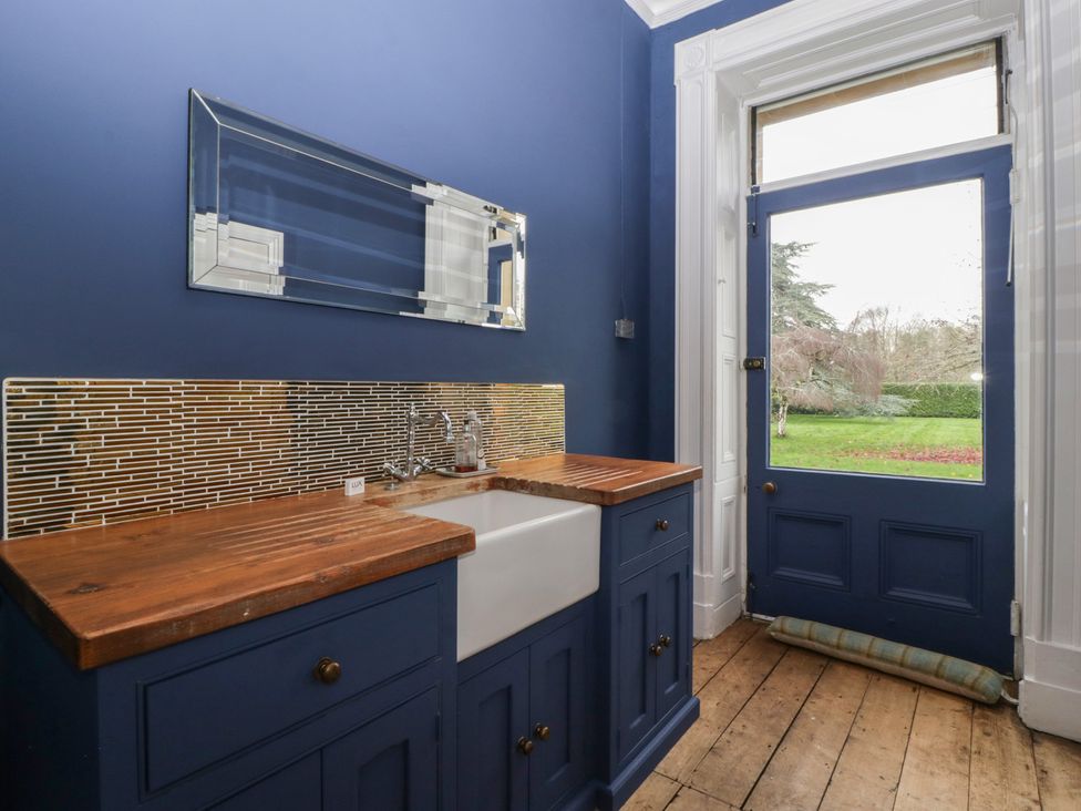 A bathroom with a sink and mirror at Frenchay Park House in Bristol