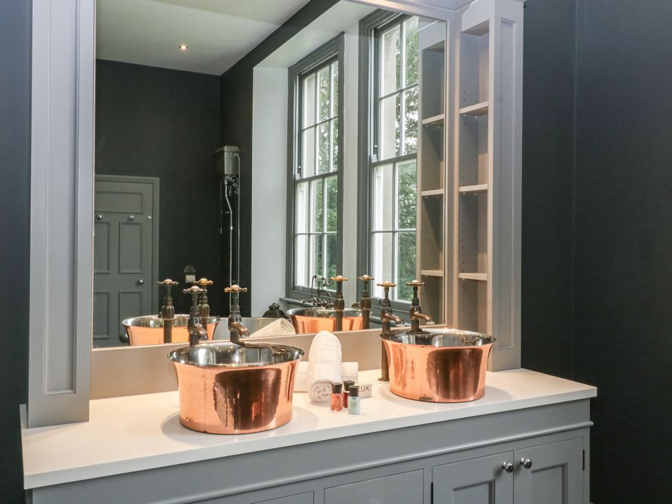 A bathroom with sinks and mirrors at Frenchay Park House in Bristol