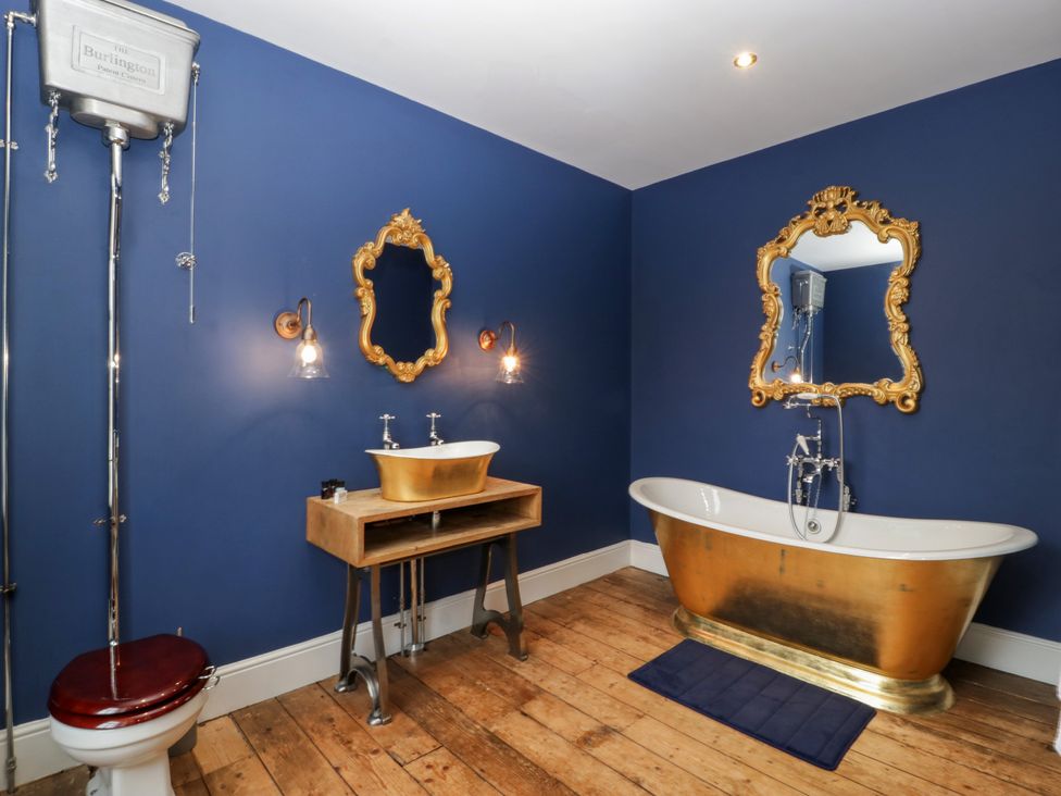 A bathroom with a bathtub and sink at Frenchay Park House in Bristol