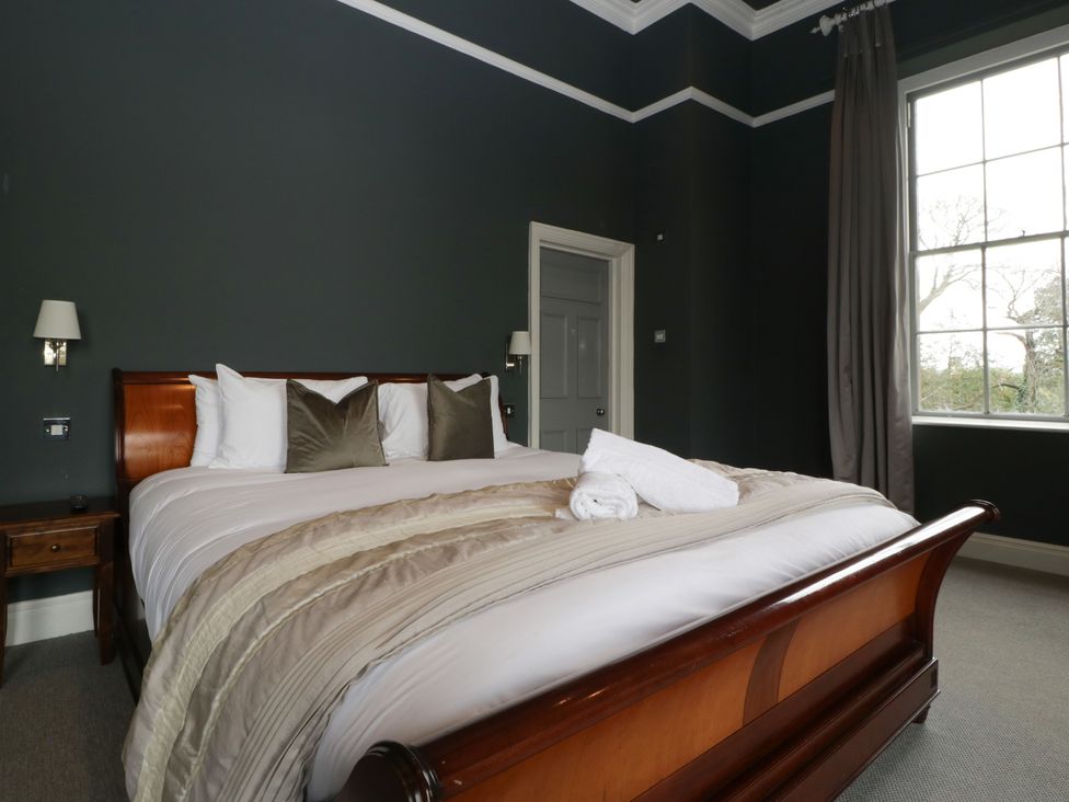 A bedroom with a bed and a window at Frenchay Park House in Bristol