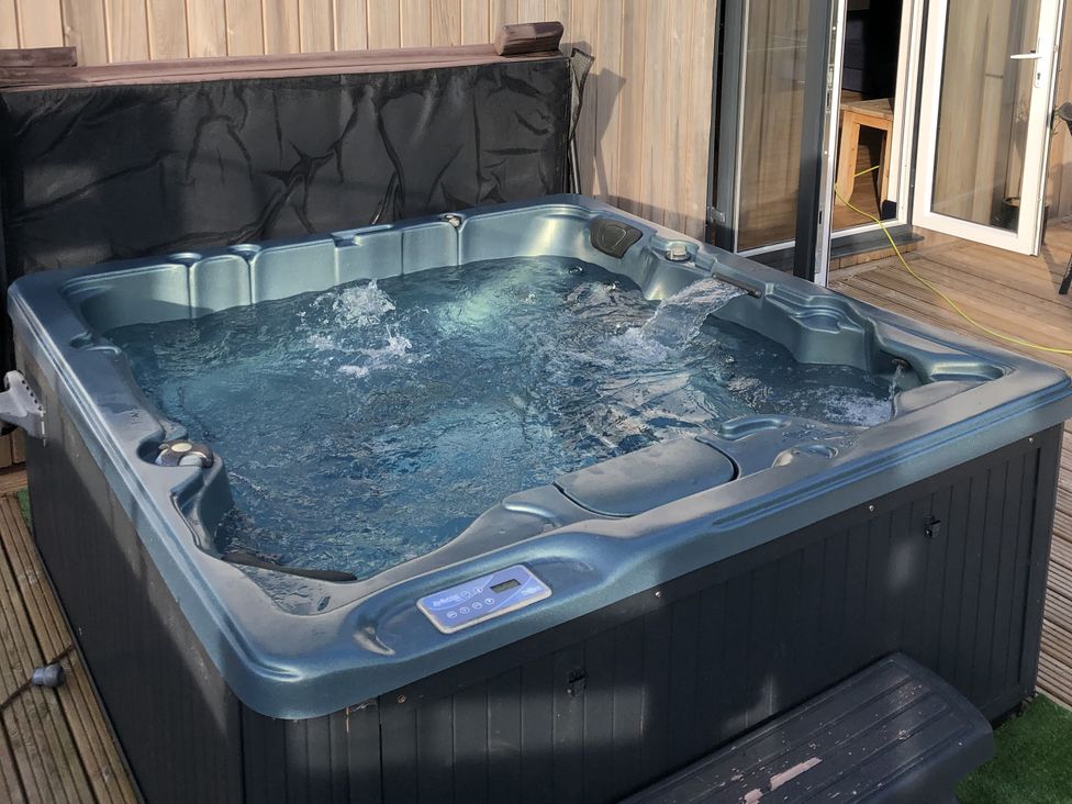 A hot tub with water and control panel at Frenchay Park House in Bristol