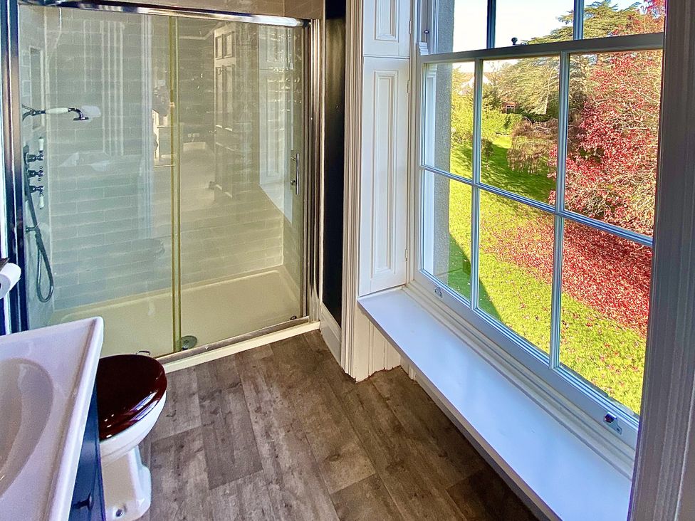 A bathroom with a shower and window at Frenchay Park House in Bristol