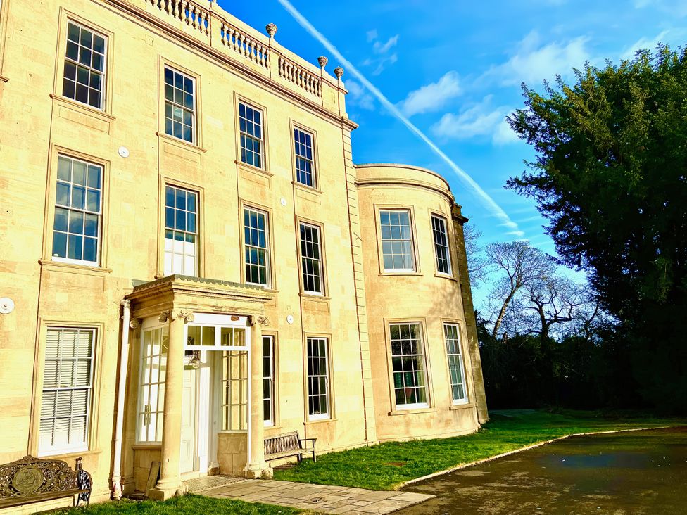 A building with large windows and a door at Frenchay Park House in Bristol