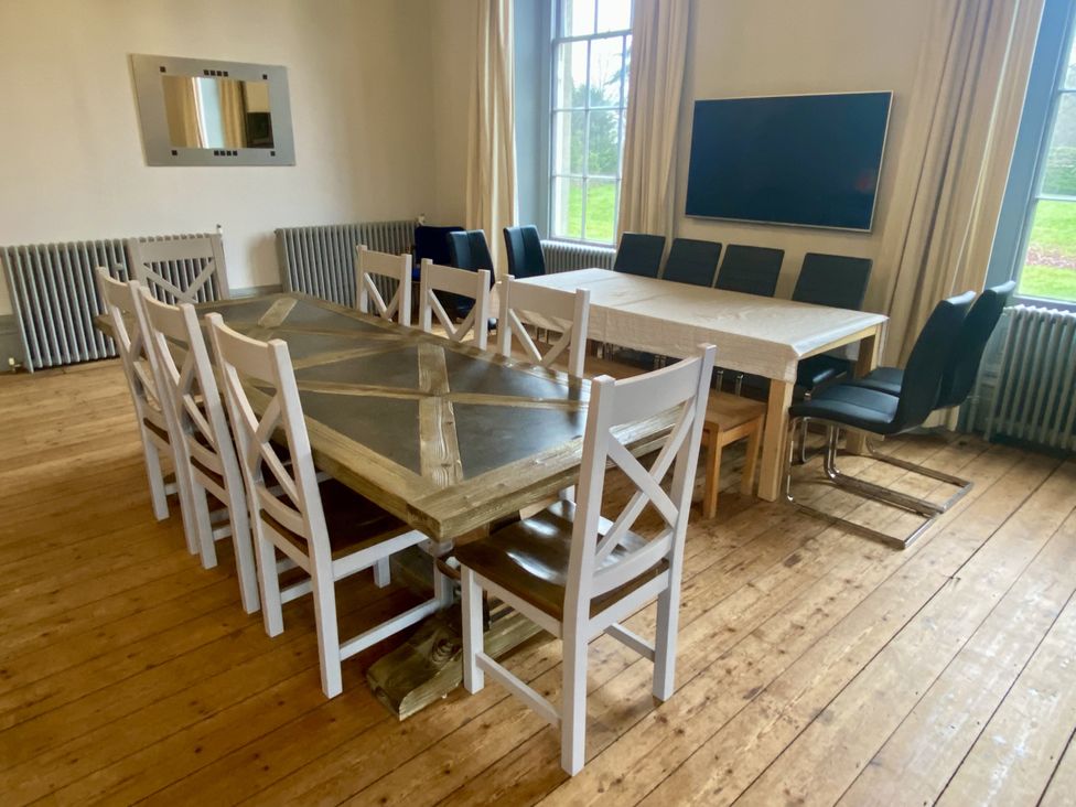 A dining room with tables and chairs at Frenchay Park House in Bristol