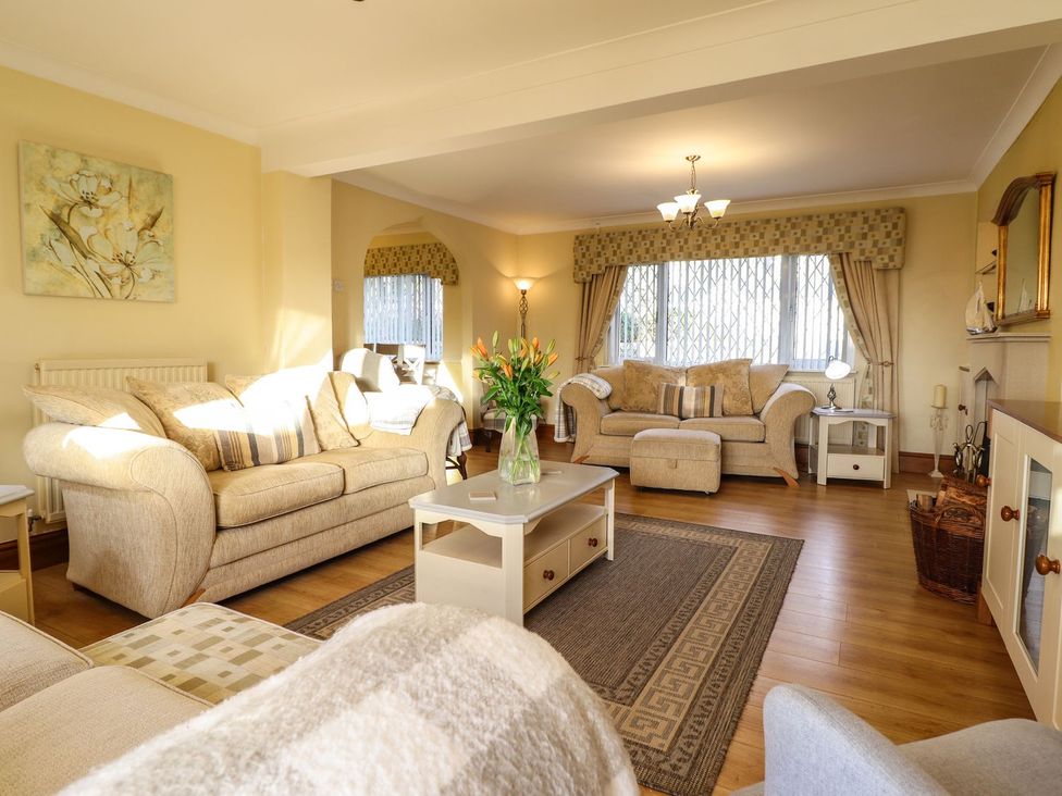 A living room with sofas and a coffee table at Llwyn Derw in Talybont