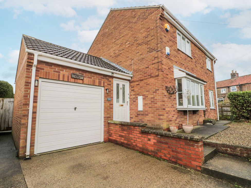 A house with a garage and front door at Thorntons House in Northallerton