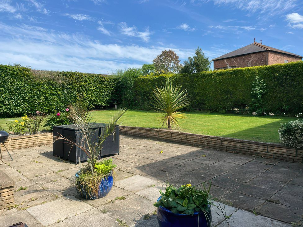 A garden with a patio and green grass at Thorntons House in Morton-On-Swale