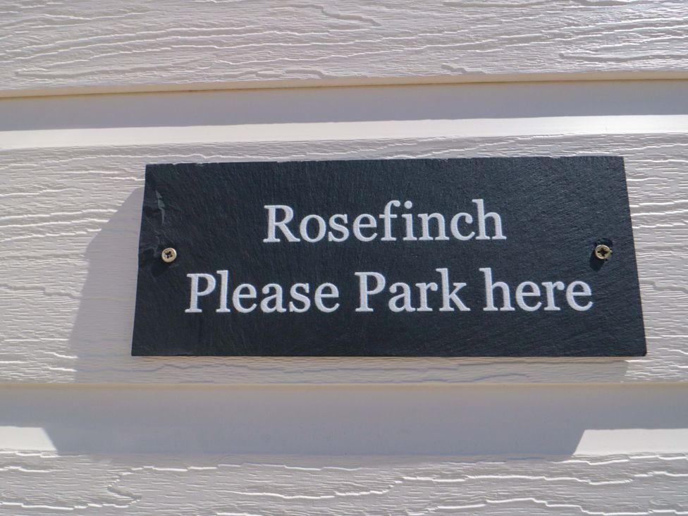 A sign that says Rosefinch Please Park here at Rosefinch Cabin Staintondale near Scarborough