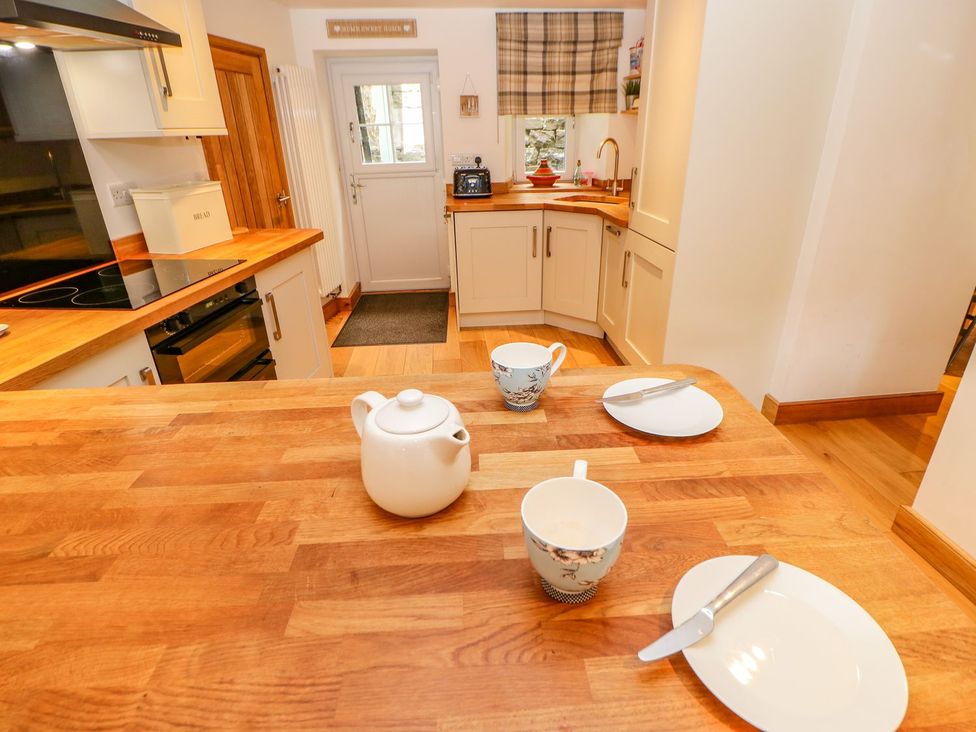 A kitchen with a table set for tea at Wayside Farm in Richmond
