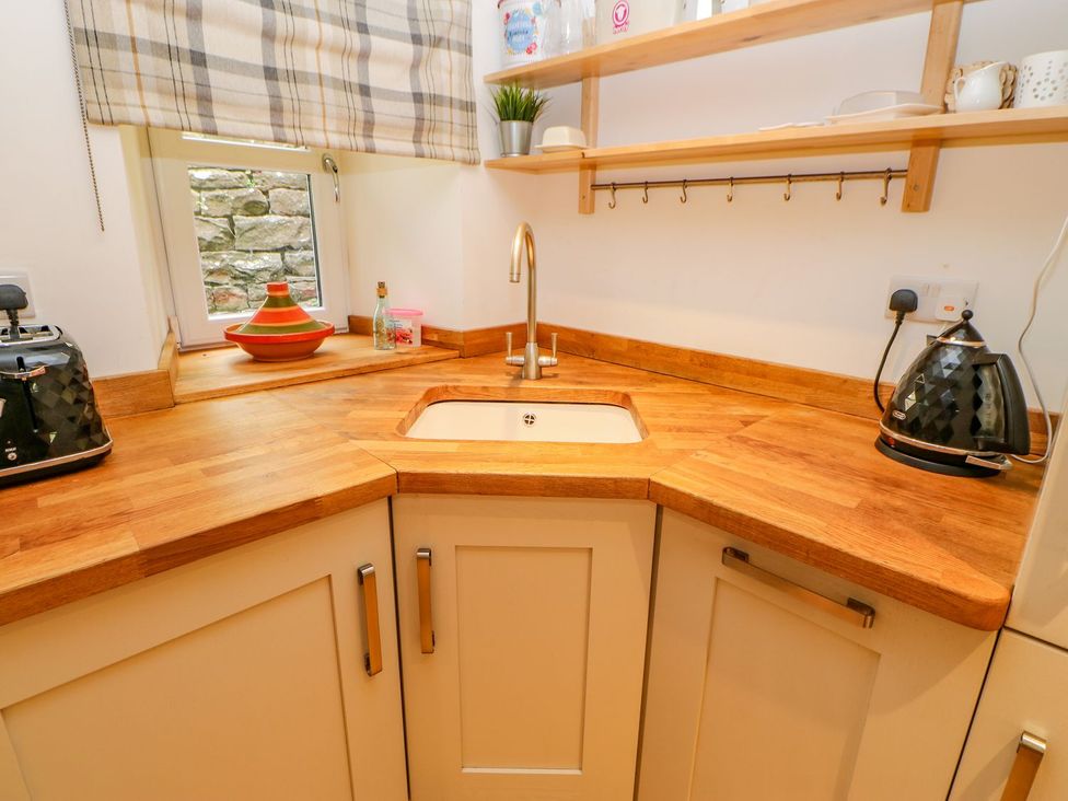 A kitchen with a sink and appliances at Wayside Farm in Richmond