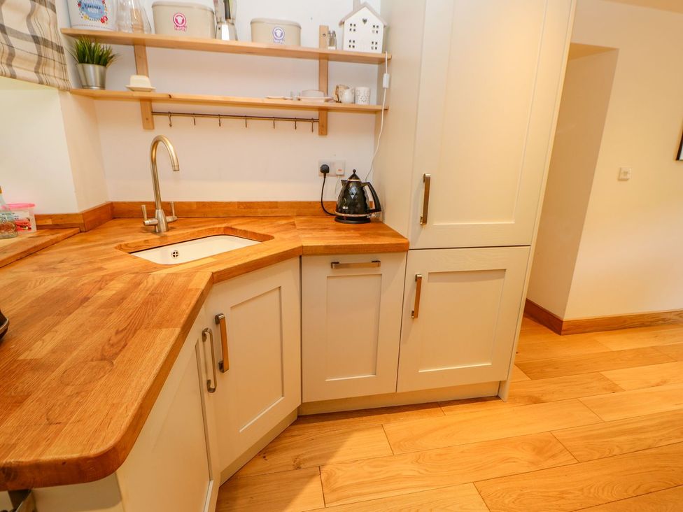 A kitchen with a sink and kettle at Wayside Farm Richmond