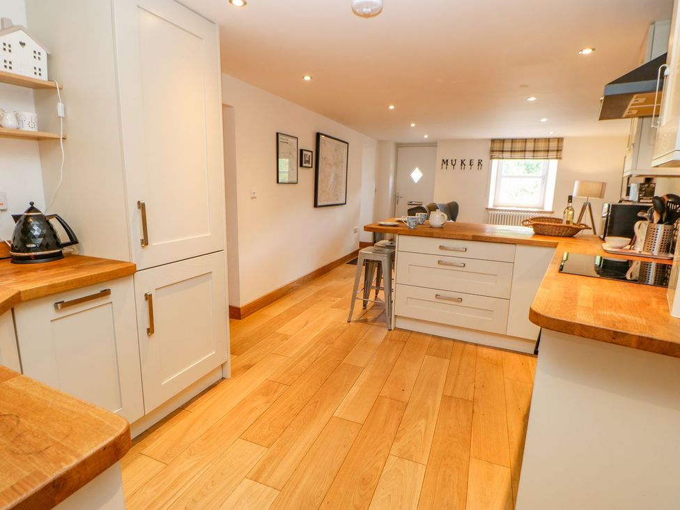 A kitchen with cabinets and a countertop at Wayside Farm Richmond