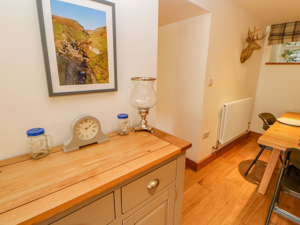 A kitchen with a clock and lamp on a counter at Wayside Farm in Richmond