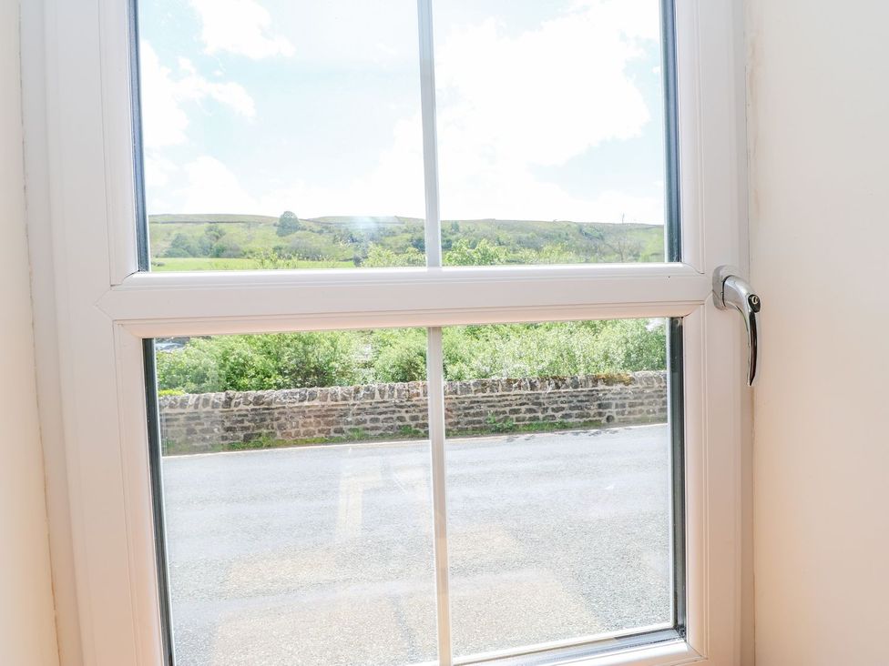 A view from a window showing a landscape and a road at Wayside Farm in Richmond
